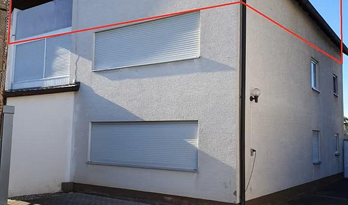 Versatile attic apartment with potential.