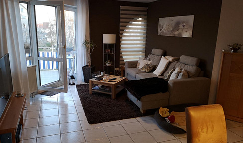 Beautiful 3-room apartment with 2 balconies, 2 outdoor parking spaces, and 1 underground parking space included.