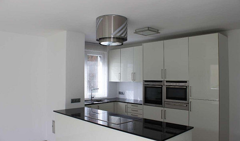 Modern apartment in Mauer with a sunny balcony and garage.