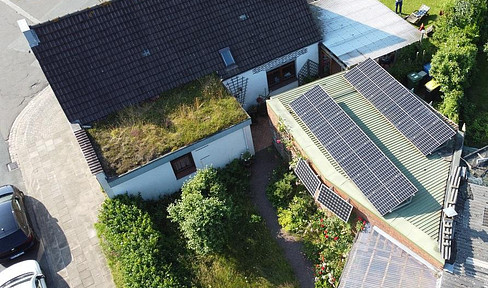 Detached house with a large garden and its own parking space.