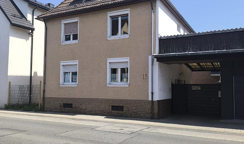 Two-family house with a lovely garden, located in a central area.