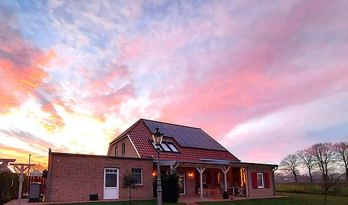 Representative detached house with solar panels and air source heat pump, offering charm in Lower Saxony, near East Frisia.