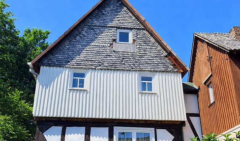 Charming half-timbered single-family house with a courtyard, covered terrace, and garage, located in Lohra.