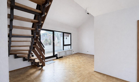 Well-maintained 2.5-room maisonette apartment with fitted kitchen and balcony in Bad Homburg.