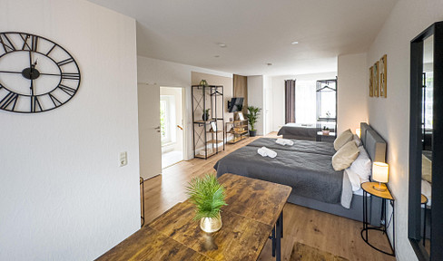 Modern living on three levels, featuring two balconies, a garage parking space, and a quiet neighborhood.