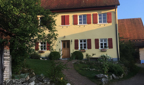 Farm property with 10,000 square meters of land, and existing building permit, suitable for development into a multi-family building.