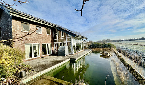 Spacious architect-designed house (317 m²) with a swimming pond, located near a field, and a wellness area.