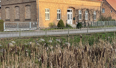 House near the Baltic Sea, former school building, solid brick construction.