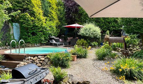 Where relaxation begins in your own garden: A secluded wellness oasis in a prime location.