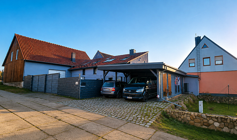 Family-friendly farm with solar panels, a heat pump, and a large barn.