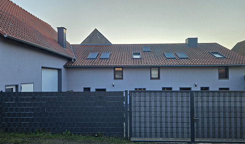 Family-friendly farm with solar panels, a heat pump, and a large barn.