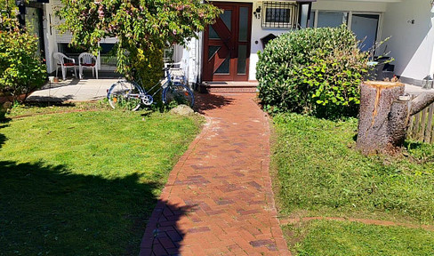 Terraced house with a large garden, full basement, insulated, large attic, and two garages.