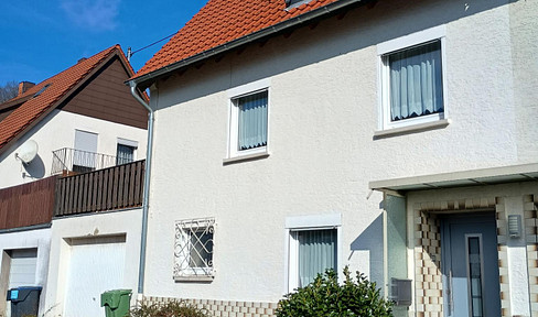 Semi-detached house with garage.