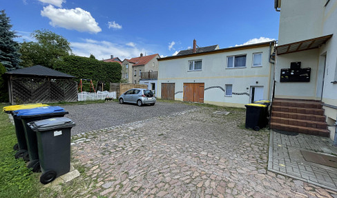 Spacious family apartment in the rear building with a balcony / garage & garden.