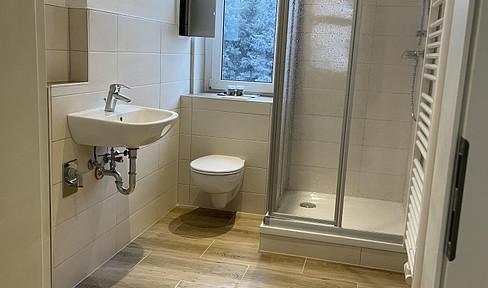 Freshly renovated apartment with recessed ceiling lights.
