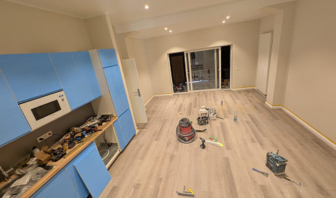 Brand new! Modern 2.5-room apartment for rent in a prime location in Rüdesheim, featuring a fitted kitchen.