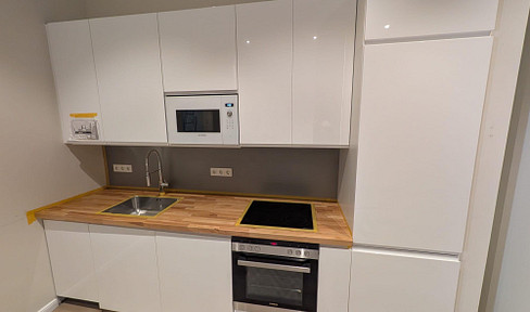 Brand new! Modern 2.5-room apartment in a prime location in Rüdesheim, featuring a fitted kitchen and a terrace.