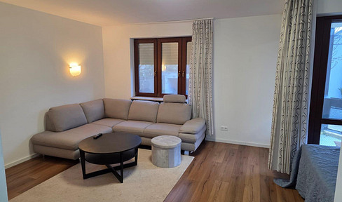 Stylish, spacious one-bedroom apartment with a balcony, underground parking space, and fitted kitchen.