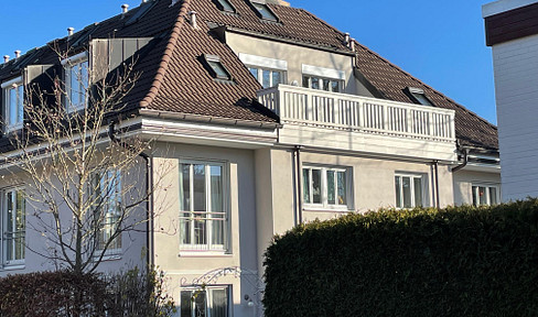 Modern, two-story apartment with a rooftop terrace, located in a prime area of Munich-Waldtrudering.