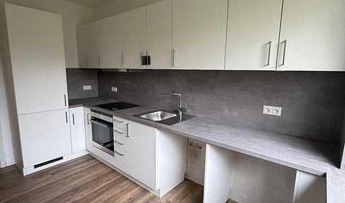 Sanierte 2-Zimmer-Wohnung mit neuer Einbauküche, Balkon & Tiefgaragenstellplatz in Quickborn