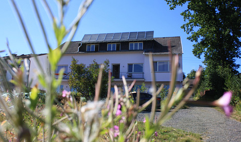 Multi-family house with a seminar area and a large plot of land.