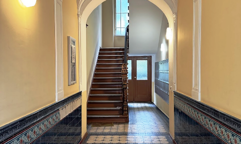 Renovation-needing apartment in a historic building, located in a vibrant neighborhood of Schöneberg, with a balcony.