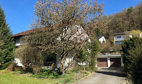 Two-family house with a beautiful property in a quiet location!