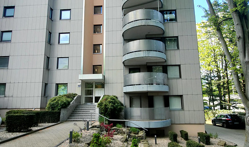 2-room apartment with balcony & parking space, and fitted kitchen.