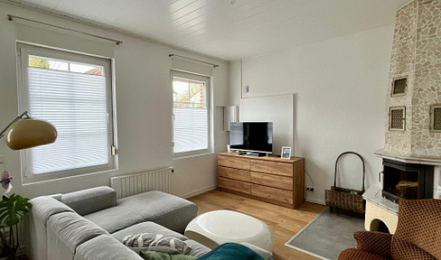 2.5-room apartment centrally located in Bad Bevensen, featuring a fireplace and a small garden.