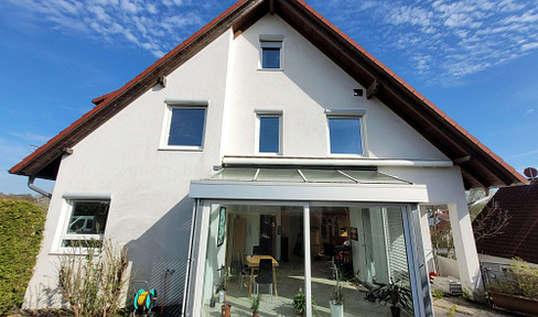Spacious semi-detached house with a conservatory.