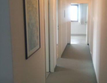 Office/commercial unit on the ground floor, approximately 184 square meters. Suitable for a practice, office, or commercial use.