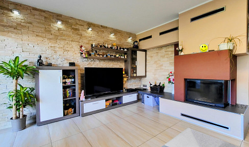 Modern, ready-to-move-in terraced house with a garden, fireplace, and balcony, located in a green area, offering potential for additional rental income.