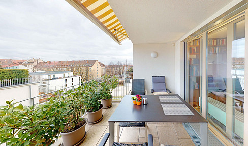 Modern city apartment with a west-facing balcony and parking space.