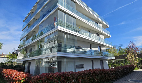 Wohnen wie im eigenen Haus – moderne Gartenwohnung am Altrhein mit Terrasse & Tiefgarage