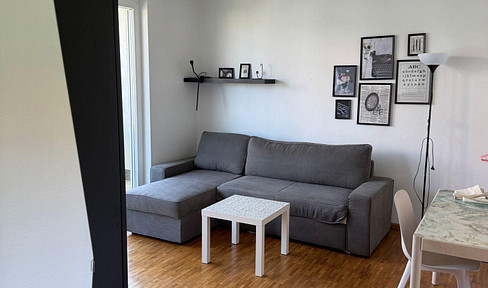 Furnished one-bedroom apartment, Wilhelmstrasse 3, central location, with balcony and rooftop terrace.
