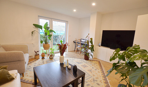 Bright, spacious 4-room garden apartment with fitted kitchen, centrally located in Spich, near the train station.