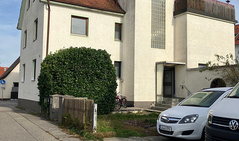 4-room apartment with garden, garage, parking space, quiet location, and good transport links.