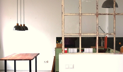 Spacious 2-room loft with 3.60-meter high ceilings and an industrial-style aesthetic.