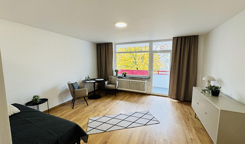 Modern, bright one-bedroom apartment with a balcony and parking space.