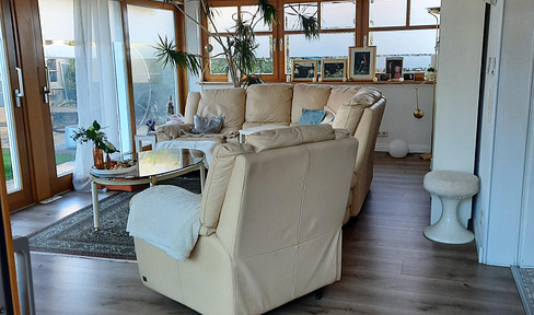 Bungalow apartment with a double garage, situated on a well-maintained property with a south-western exposure.