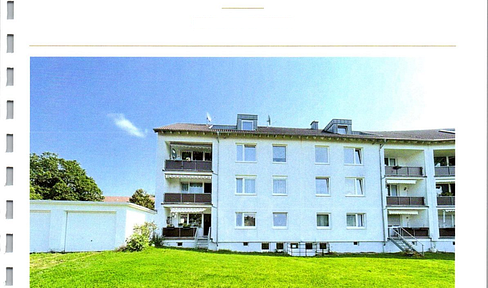 Sunny 4-room ground floor apartment with balcony and garden access, located in a desirable residential area.