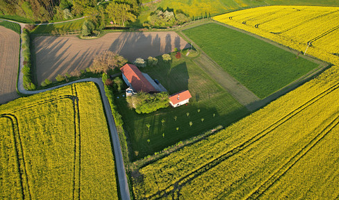 Agricultural property.
Alternatively:
Farm.
Agricultural estate.
Agricultural holding.