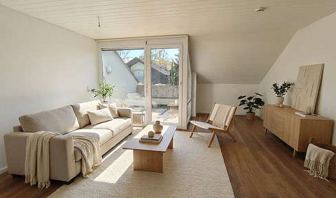 Dreamy 3-room penthouse apartment right on the Swiss border, including a parking space.