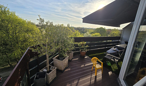 Renovated penthouse apartment with a skyline view.