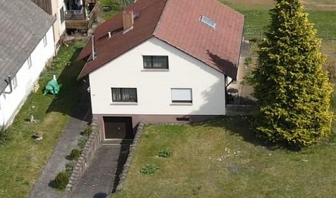 House for sale in Bernstadt, with a large plot of land.