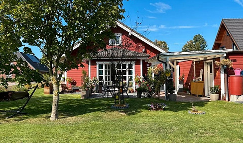 Charming wooden bungalow on a corner lot.