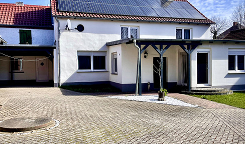 Detached house with a courtyard and garden.