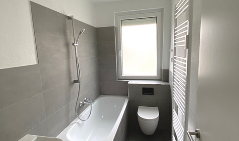 Completely renovated 3-room apartment with a balcony, bathtub, and additional rooms in the attic.