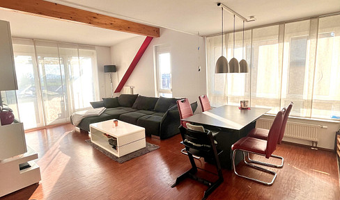 Furnished 4.5-room attic apartment with a gallery, large balcony, underground parking, and an electric vehicle charging station.