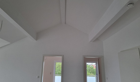 First occupancy - spacious, beautifully designed 3-room attic apartment with a balcony and loggia in Grafing, offering a stunning view.